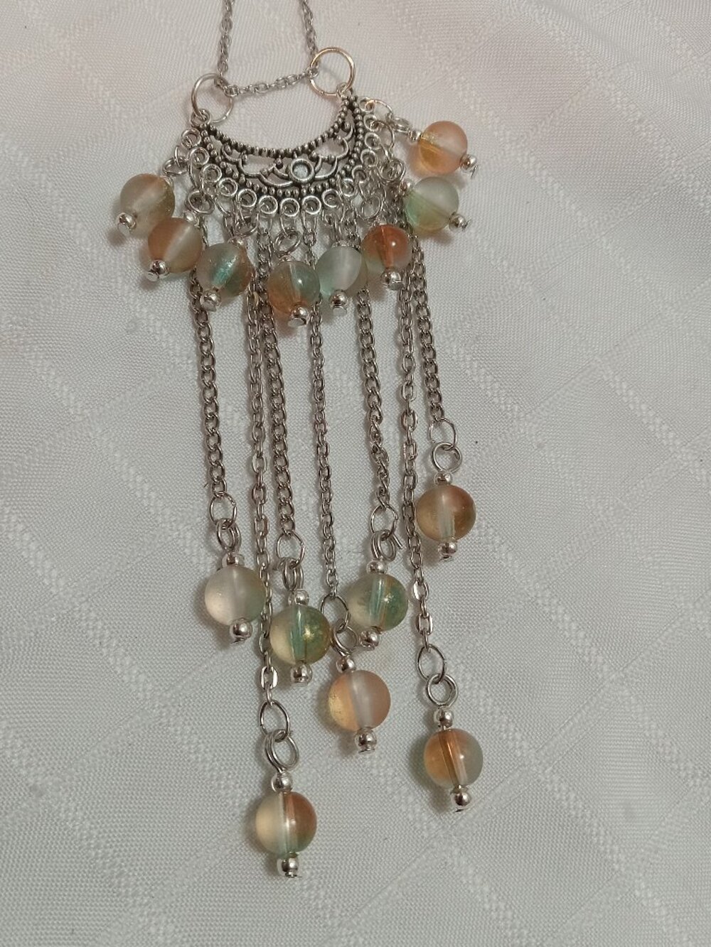 Exquisite handmade necklace featuring a half-moon-shaped Tibetan silver charm